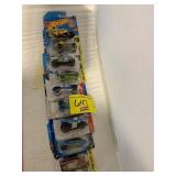 ROW OF HOT WHEELS CARS ON CARDS