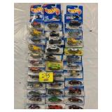 3 ROWS OF HOT WHEELS CARS ON CARDS