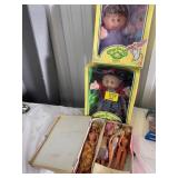 2 CABBAGE PATCH DOLLS, 4 BARBIES IN FASHION CASE