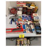 CASSETTES UNDER TABLE, BOOKS, SNAPHOOK, LIGHT