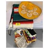 SOMBRERO, BOX OF TABLECLOTHS UNDER TABLE,