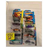 2 ROWS OF HOT WHEELS CARS ON CARDS