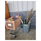 GALVANIZED TRASHCAN FULL OF CURTAIN RODS, PLASTIC