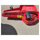 HOMELITE GAS POWERED CHAIN SAW IN HARD CASE. GOOD