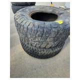 2 LARGER SIZE MISC TIRES - TOP IS GOODRICH MUD