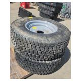 (2) LARGE TITAN MULTI TRAC C/X TIRES.