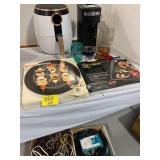 2 BOXES OF CORDS UNDER TABLE, COFFEE MAKER, AIR