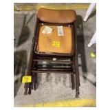 STACK OF METAL FOLDING CHAIRS