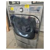 GREY LG DRYER ON STORAGE DRAWER BASE