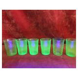 Vintage vaseline glass swirl glasses.