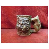 1971 Rumph Pottery Ogre face w/nude female.