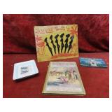 Vintage Zulu Lulu swizzle sticks, German book.