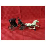 Cast iron horse & carriage.