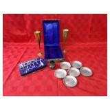 Brass champagne glasses, coasters, magnifiers.