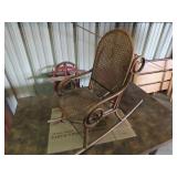 Vintage Child size cane seat rocking chair.