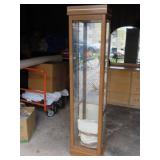 Lighted display cabinet w/glass shelves.
