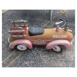 Vintage fire truck ride on child's toy.