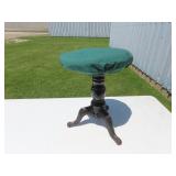 Antique cast iron piano stool.