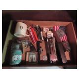 Cap gun, mug, pens, staplers, paperweights.