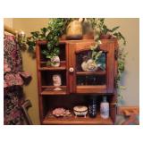 Contents of cabinet/shelf. perfume bottles, misc