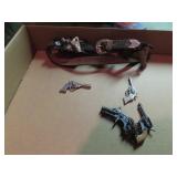 Vintage western gun belt small guns.