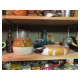 Glass basket, duck and contents on shelf.
