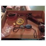 Dice, Belt & buckle, bolo tie, bank, model gun.