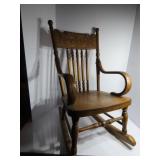 Antique Child's pressed wood rocking chair.