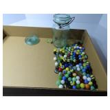 Vintage glass jar w/ assorted marbles.