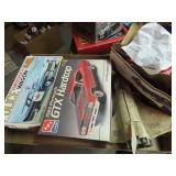 Assorted model kit boxes & parts.