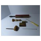 Razor strop, shaving brush, metal containers.
