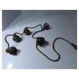 Vintage brass bells on rope.