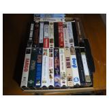 Assorted VHS movie cassettes.