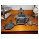 Vintage queen cast iron stove toy w/misc