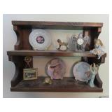 Knick knack shelf, clocks & figures.