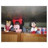 Contents on cabinet. Minnie mouse lunch box.