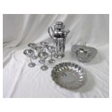 Chrome plated drink shaker, stemmed cups, dishes.