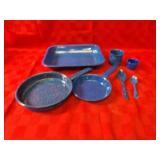 Blue enamel pans, skillets, mugs, spoons.