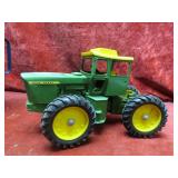 Ertl John Deere articulating tractor farm toy.