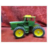 Ertl John Deere articulating tractor farm toy.