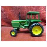 Ertl John Deere tractor farm toy.