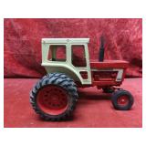 Ertl International 1466 Farmall tractor farm toy.