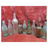 Old soda pop advertising bottles.