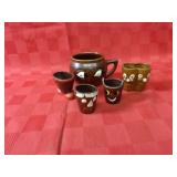 Vintage pottery face mug shot glasses.