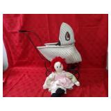 Doll wicker baby buggy w/doll.