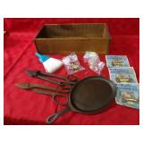 Cast iron skillet, wood box, window locks.