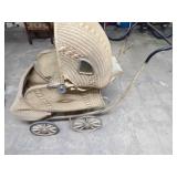 Antique wicker baby buggy.