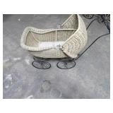 Antique wicker baby buggy.