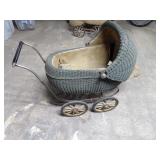 Antique wicker baby buggy.