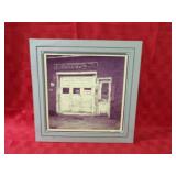 Framed signed numbered garage photograph.